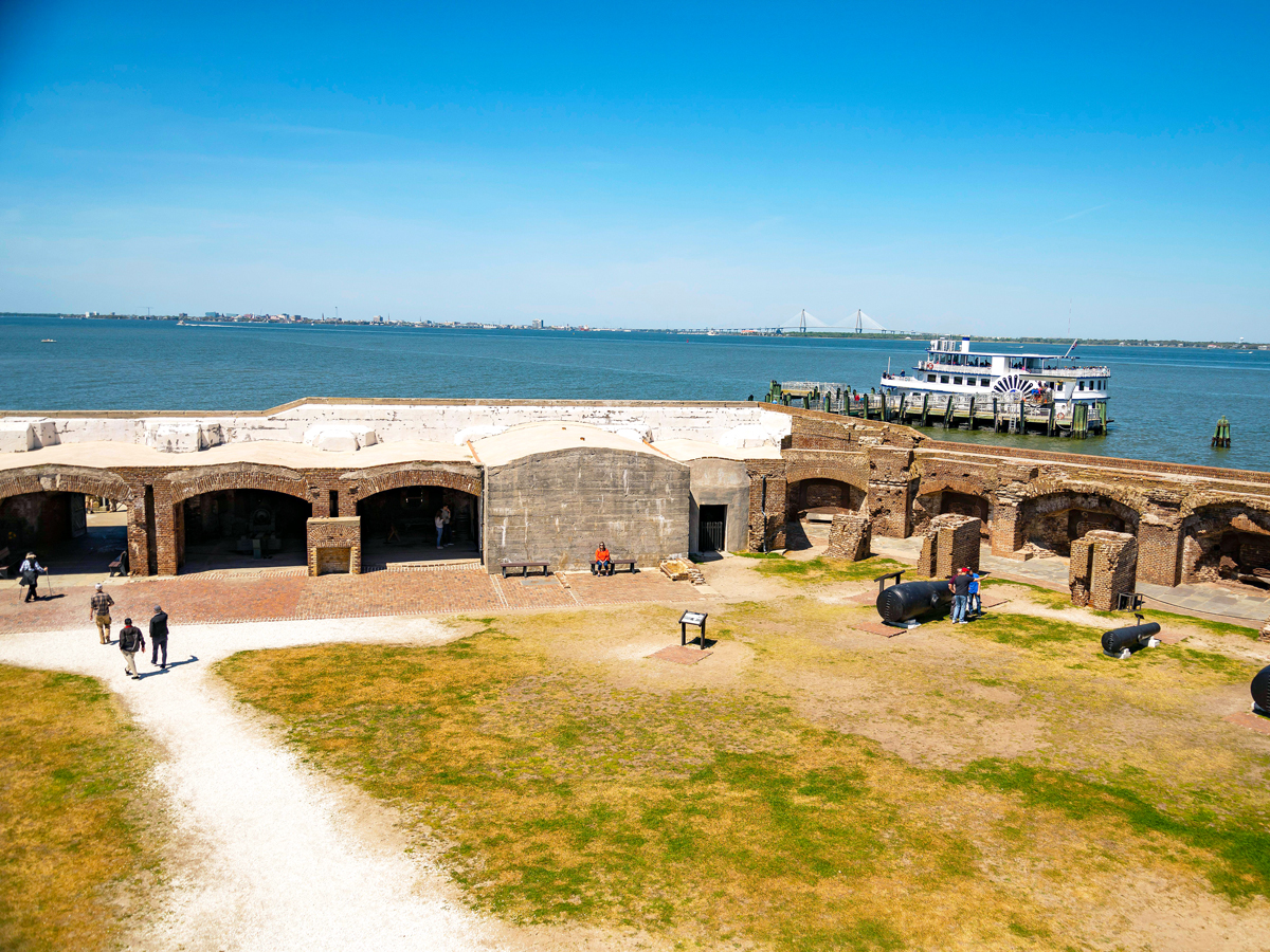 Tourists walking through Fort Sumter National Monument in South Carolina
