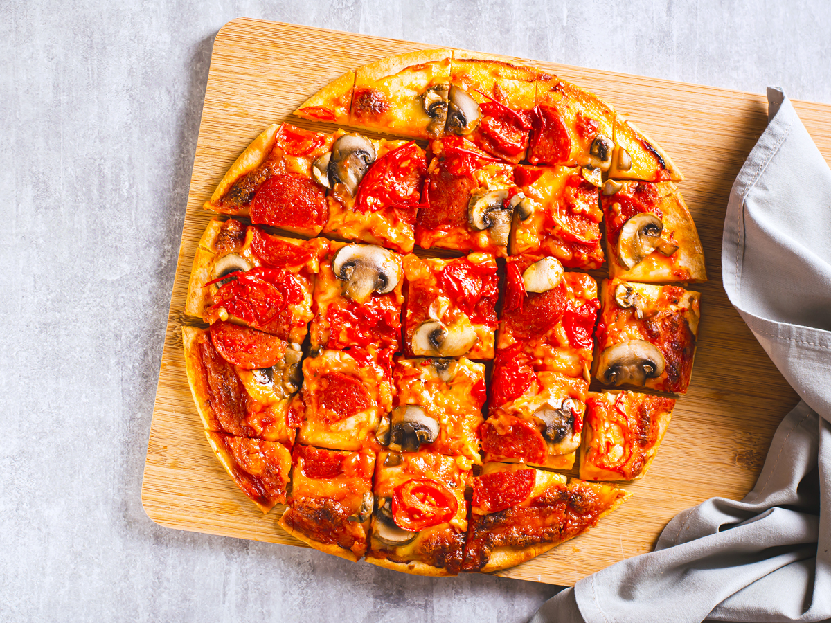 St. Louis-style pizza on cutting board
