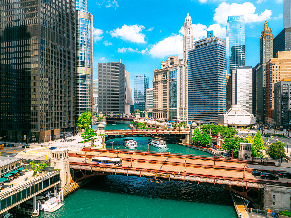 Aerial view of the Chicago River, flanked by skyscrapers