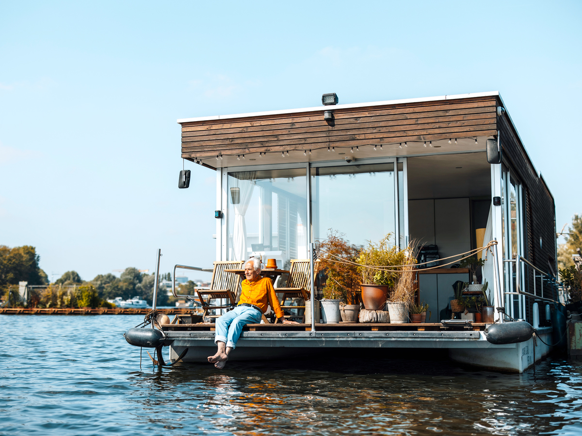 Man sitting on houseboat deck