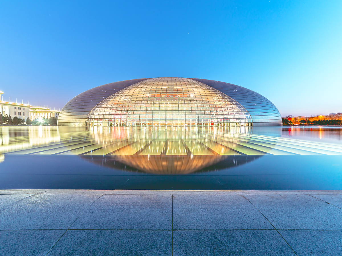 Beijing's National Centre for the Performing Arts illuminated at dusk