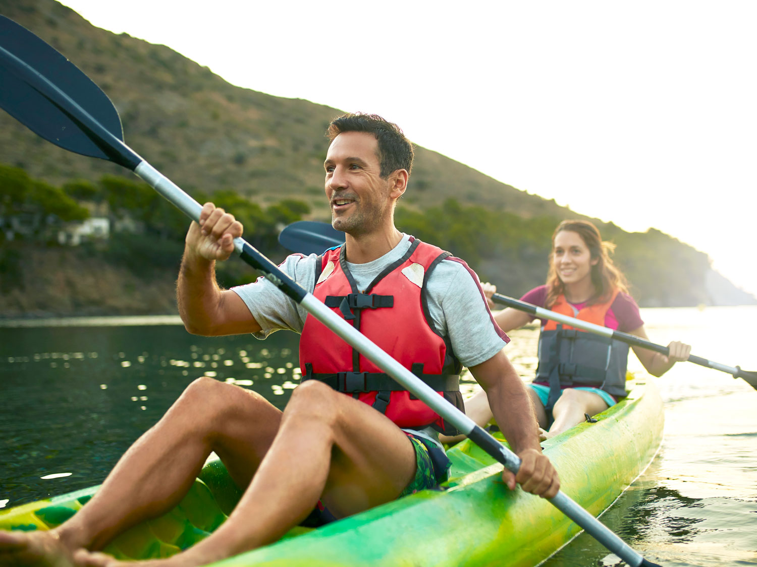Couple kayaking on lake