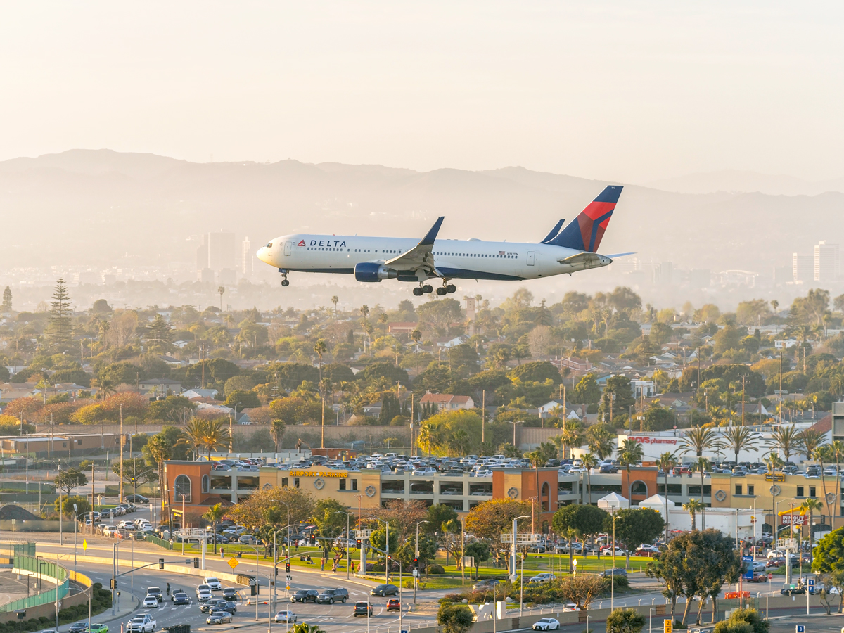 Delta Air Lines Boeing 767 on approach to Los Angeles International Airport at sunset