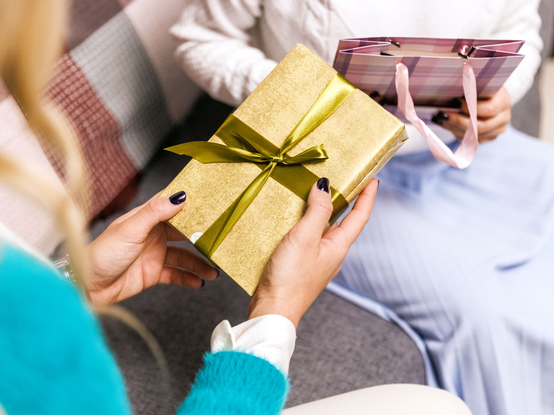 Person holding wrapped gift