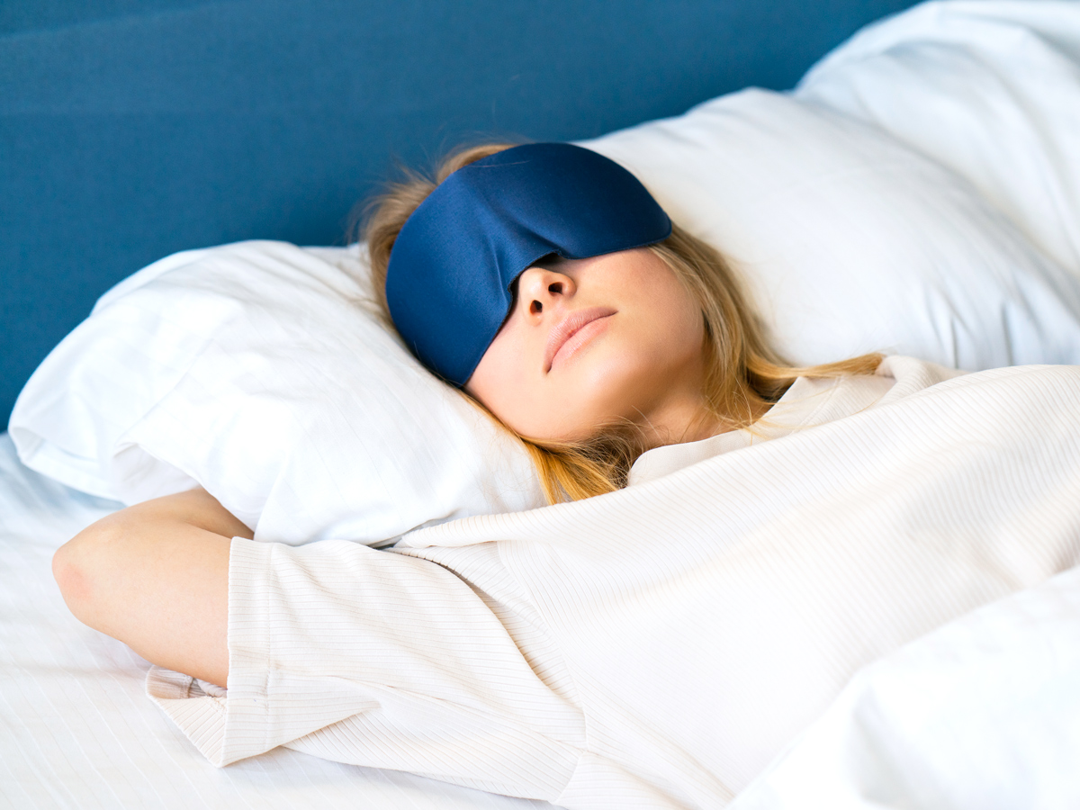 Person sleeping with eye mask