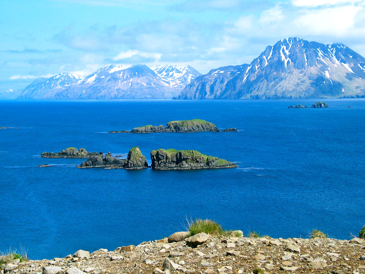 Rocky islets and snow-capped mountains on the Bering Sea