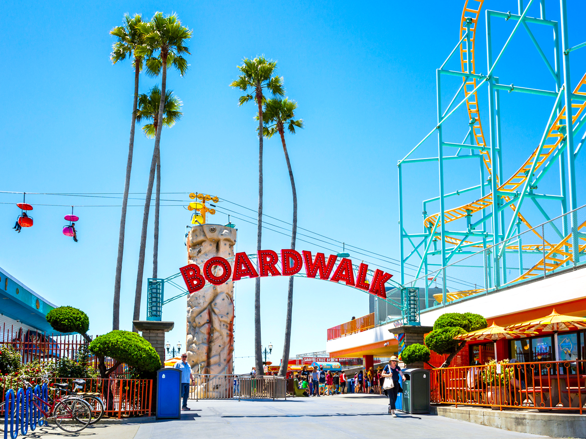 Entrance to Santa Cruz Beach Boardwalk with amusement park rides