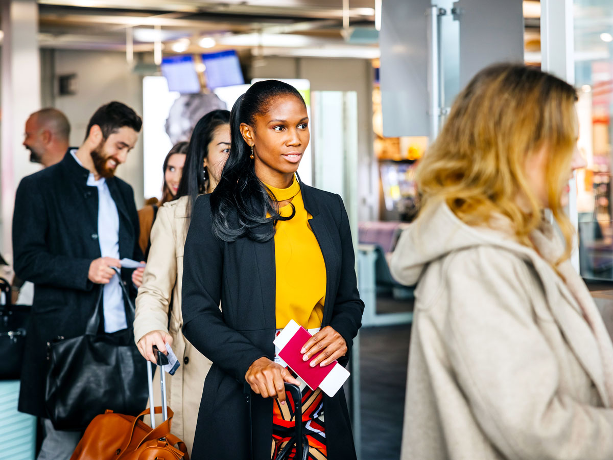 Passengers lining up to board airplane