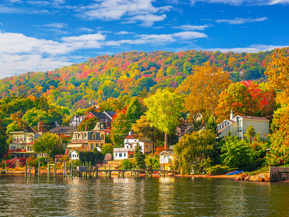 Waterfront homes and fall foliage in the Catskills, New York