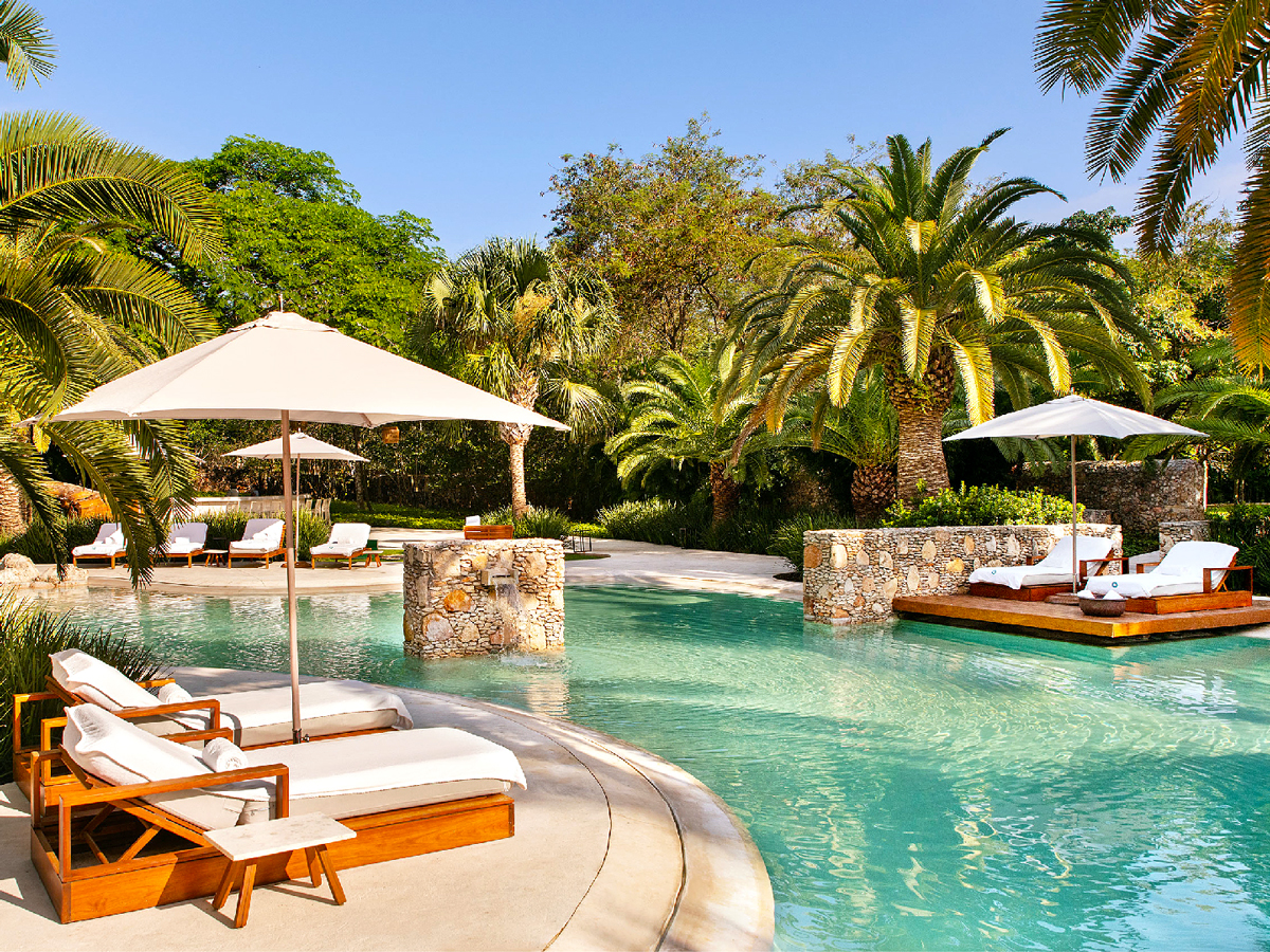 Poolside lounge chairs at Chablé Yucatán in Mexico