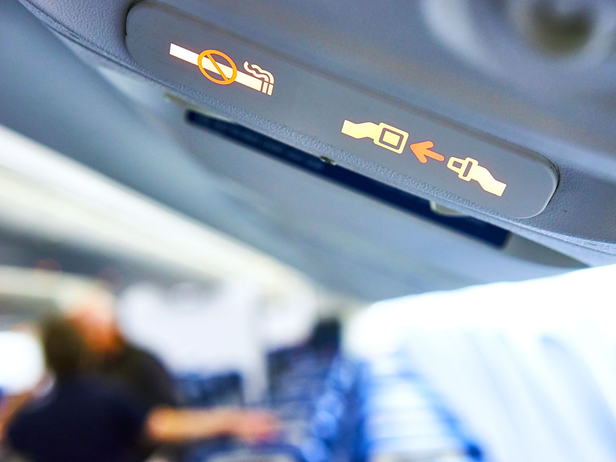 Illuminated "no smoking" and "fasten seatbelt" signs on aircraft