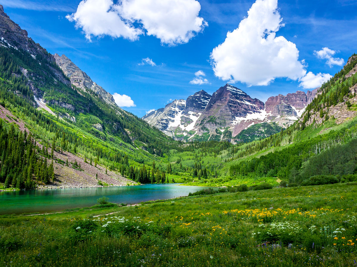 Aspen-covered mountain slopes and lake in Colorado