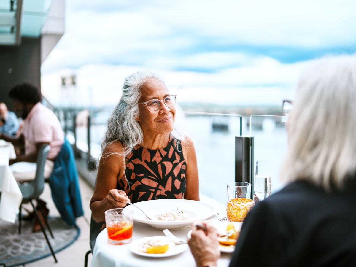 Two people dining at rooftop restaurant