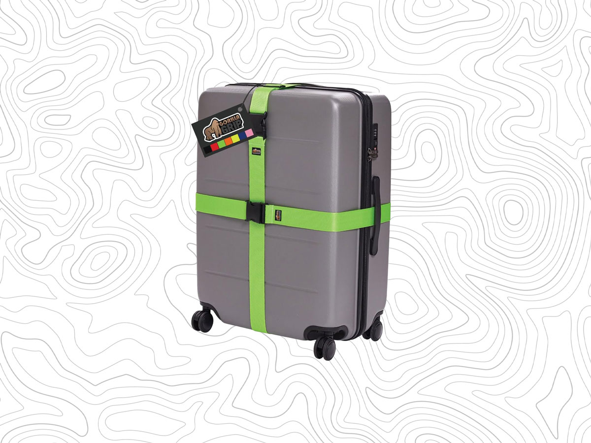 Suitcase with neon green luggage belt