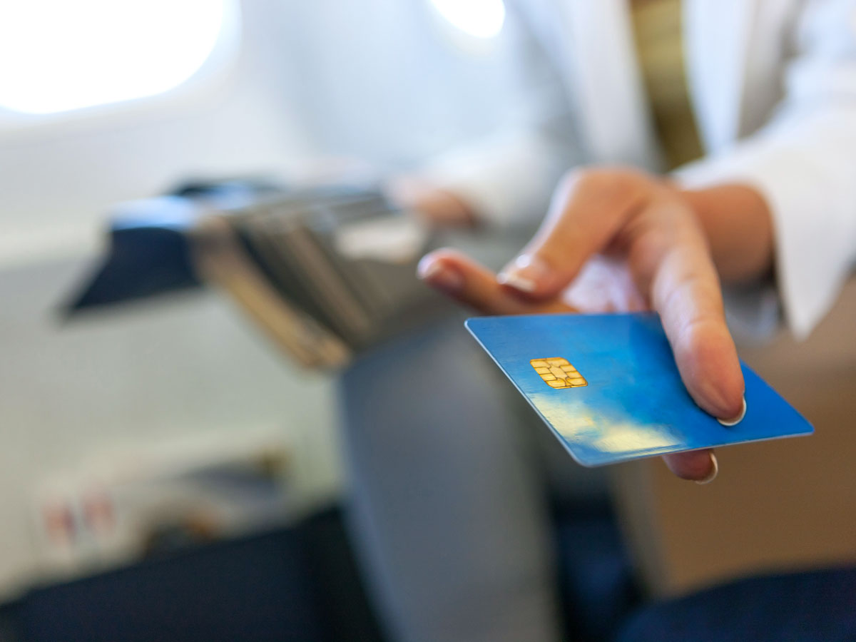 Airline passenger holding credit card