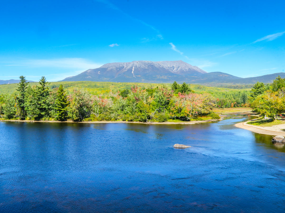 Aerial view of lake, forest, and mountains in Katahdin Woods and Waters National Monument, Maine 
