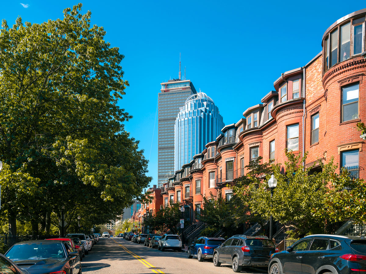Row homes with skyscrapers behind in Boston, Massachusetts