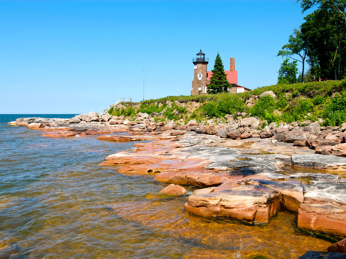 Lighthouse along the rocky coastline of the Apostle Islands National Lakeshore in Wisconsin