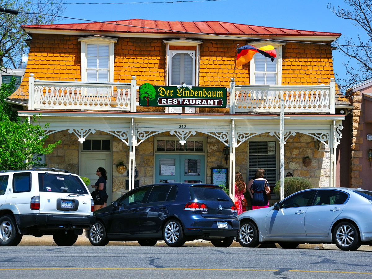 Cars parked outside restaurant in Fredericksburg, Texas