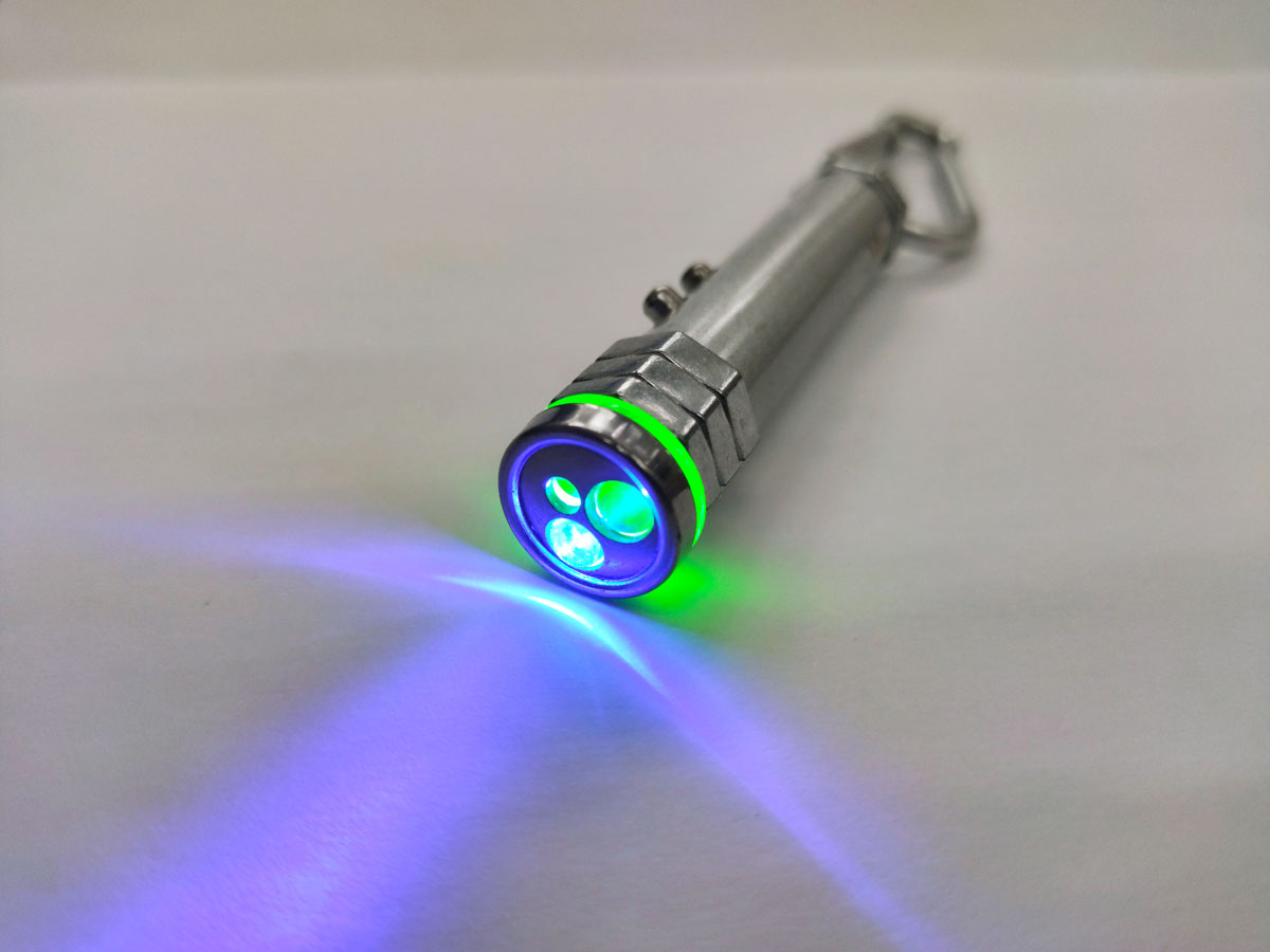 A laser pointer shining a purple color