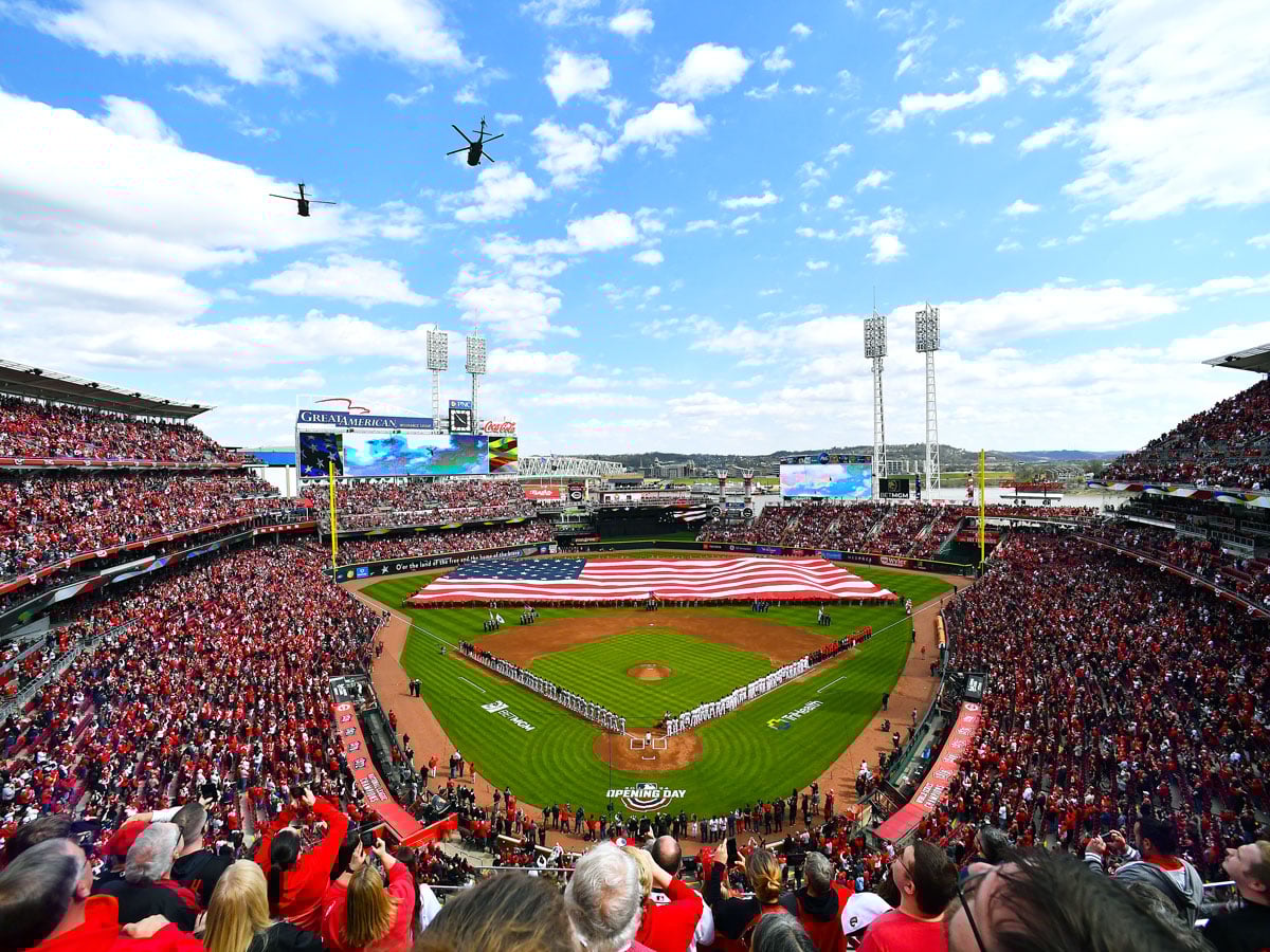Helicopters flying American flag draped on outfield of Great American Ballpark in Cincinnati, Ohio