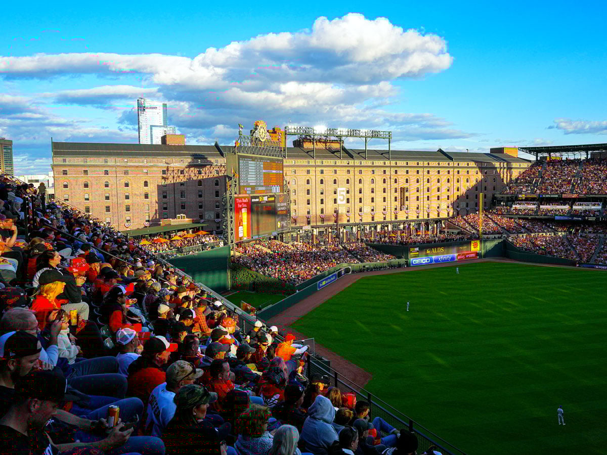 Fans watching game at sunset at Oriole Park in Baltimore, Maryland