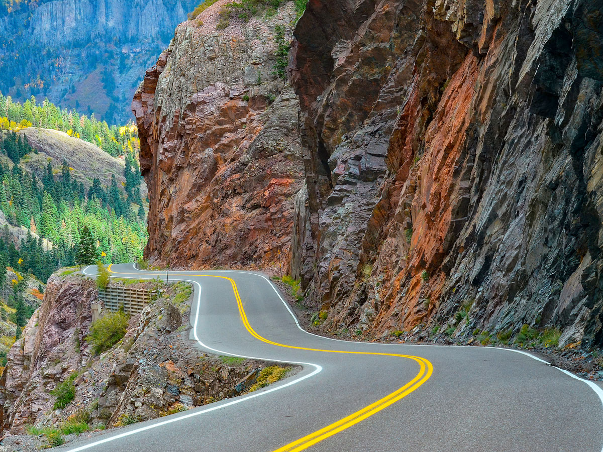Million Dollar Highway hugging mountainside without guardrails