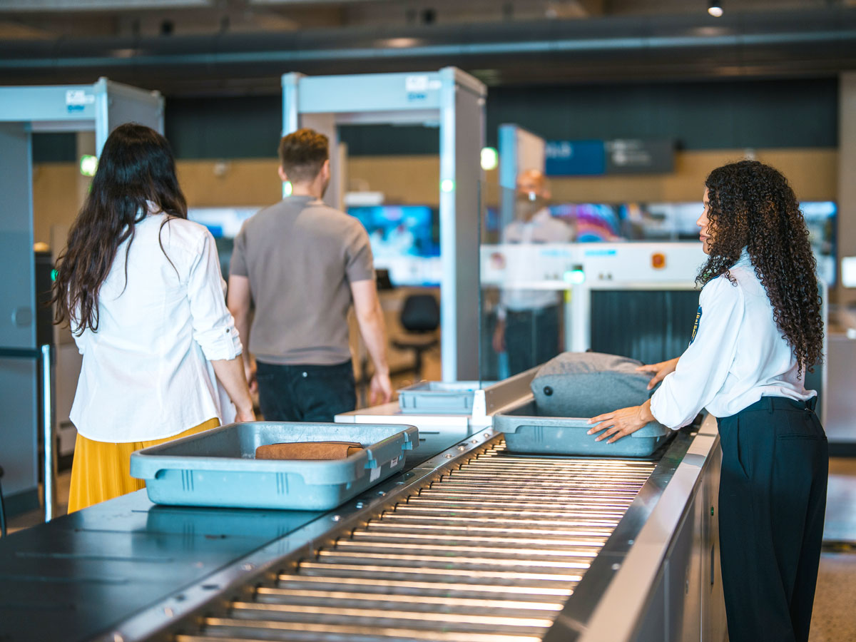 Airline passengers undergoing security screening