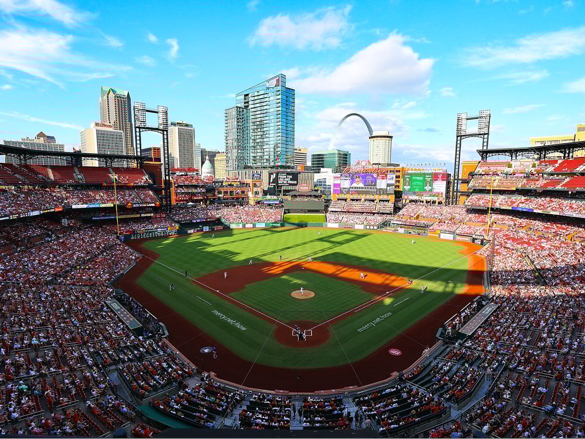 Game at Busch Stadium with Gateway Arch and St. Louis skyline in background