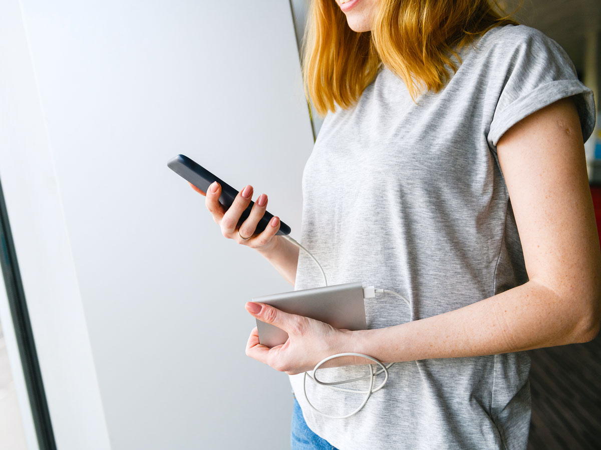 Person using portable charging device