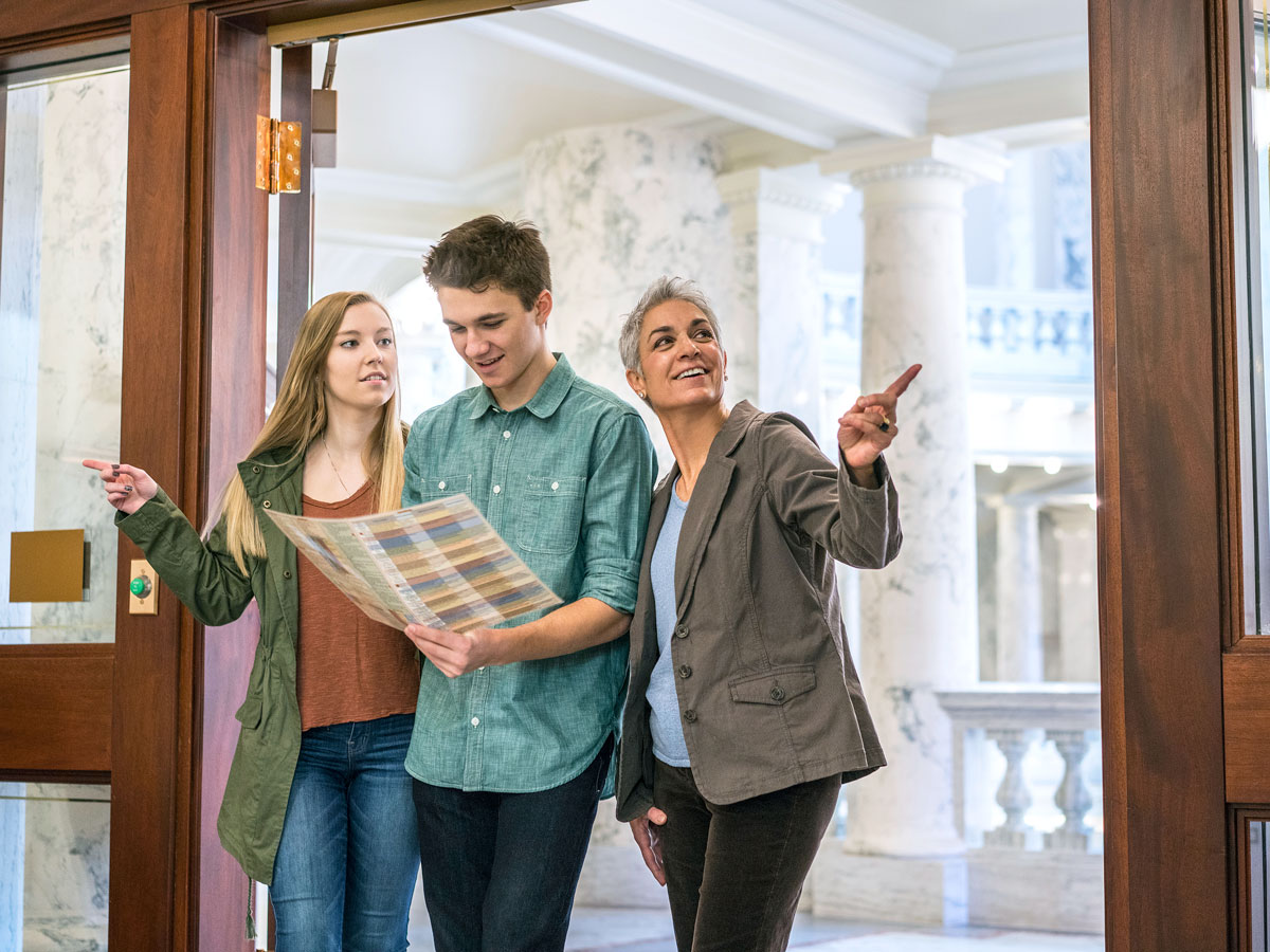 Museum visitors with map of exhibits
