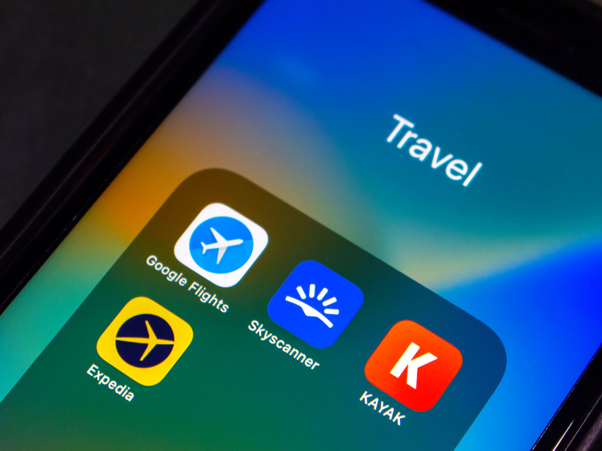 Close-up view of travel apps on cellphone