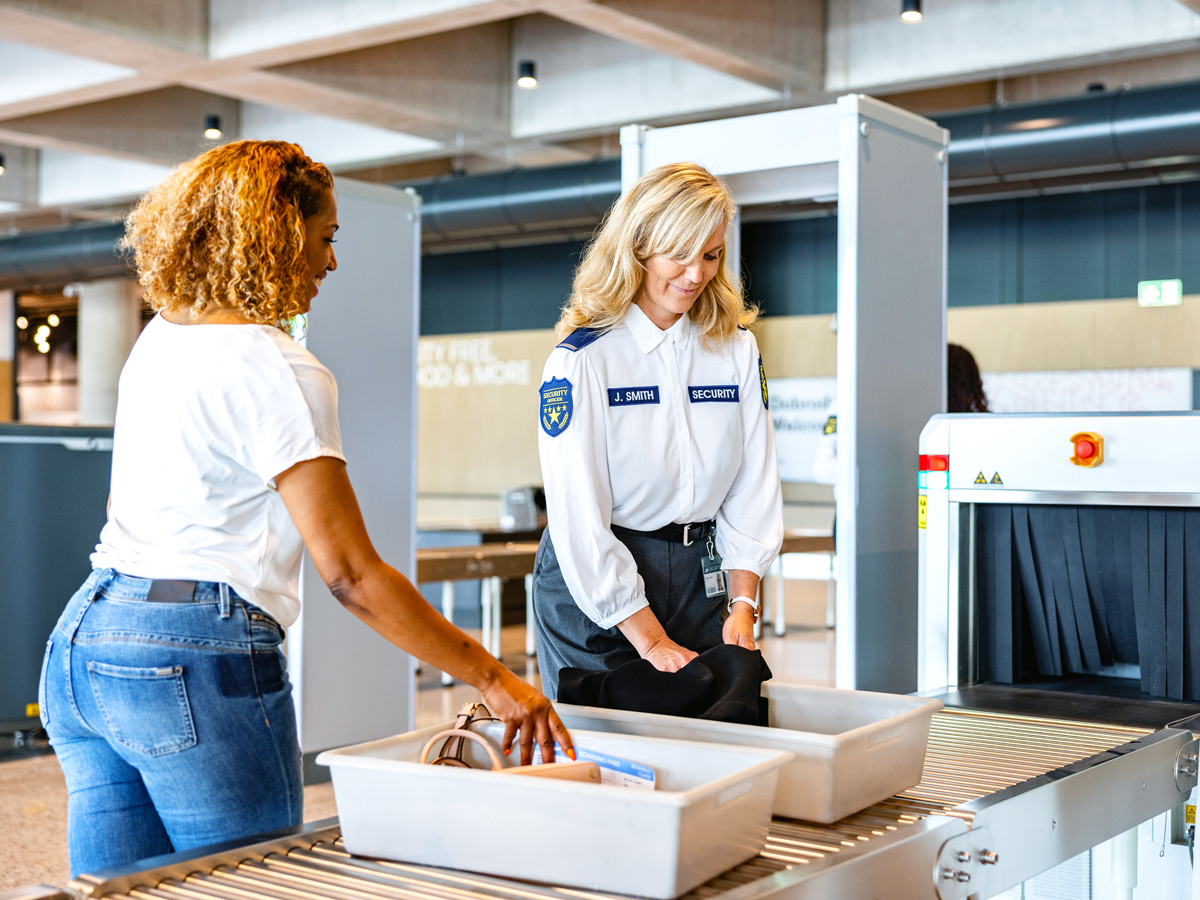 Traveler undergoing security screening at airport