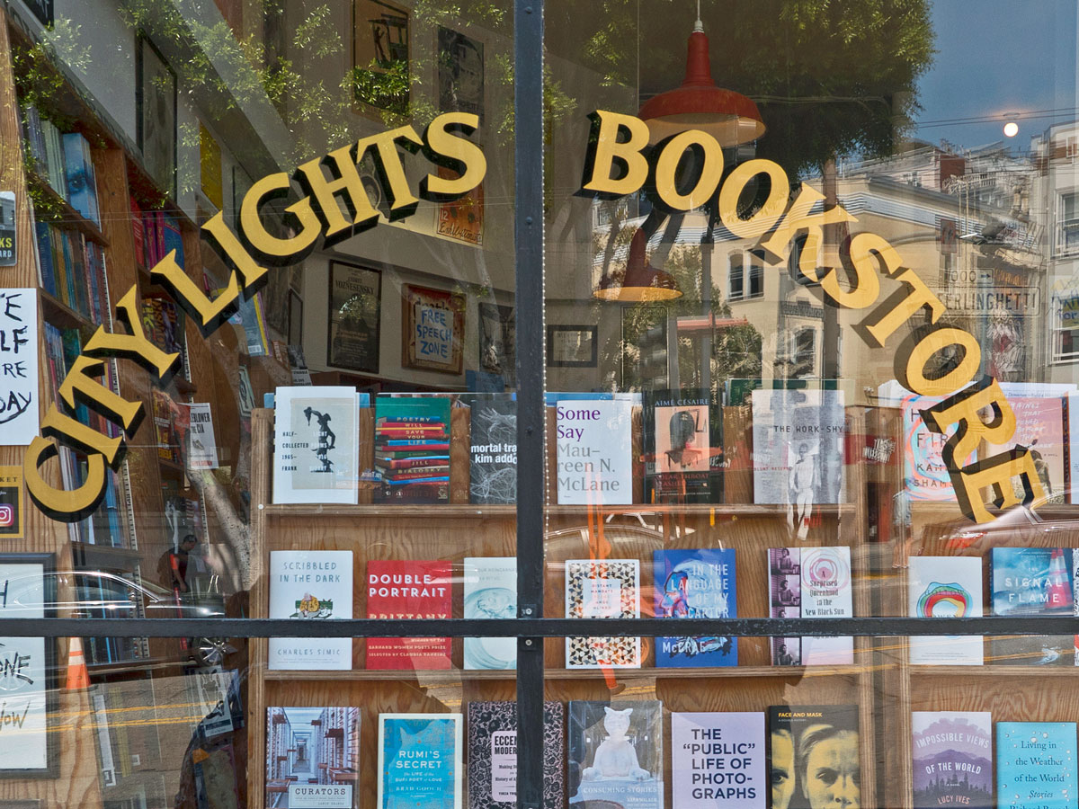 Sign on window for City Lights Bookstore in San Francisco, California