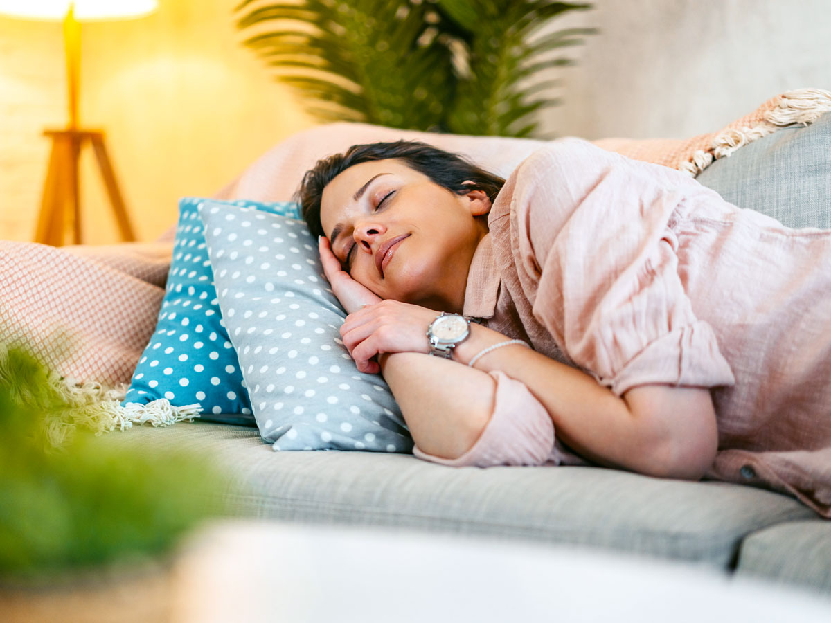 Woman napping on couch
