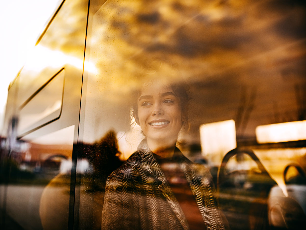 Passenger looking out bus window