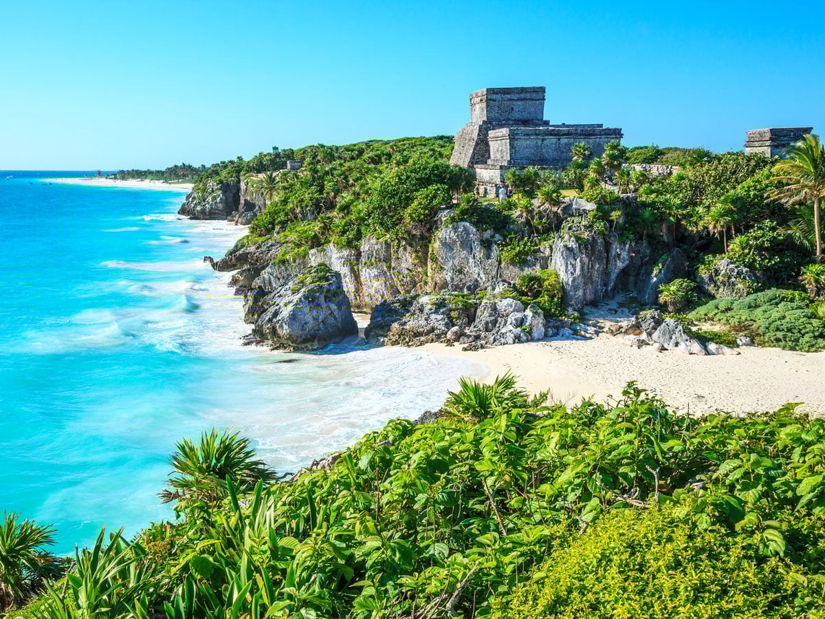 Maya ruins on cliffs overlooking beach in Tulum, Mexico