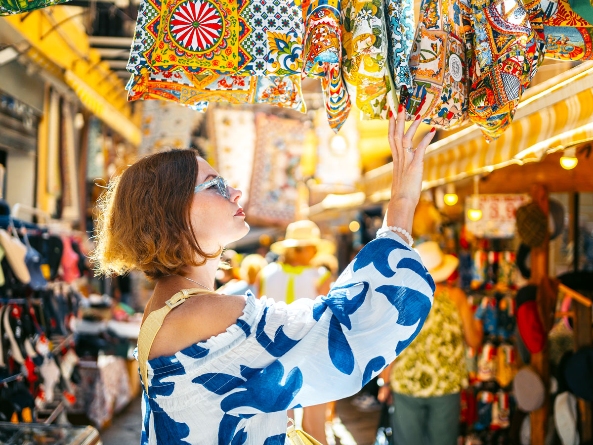 Tourist shopping for souvenirs at market
