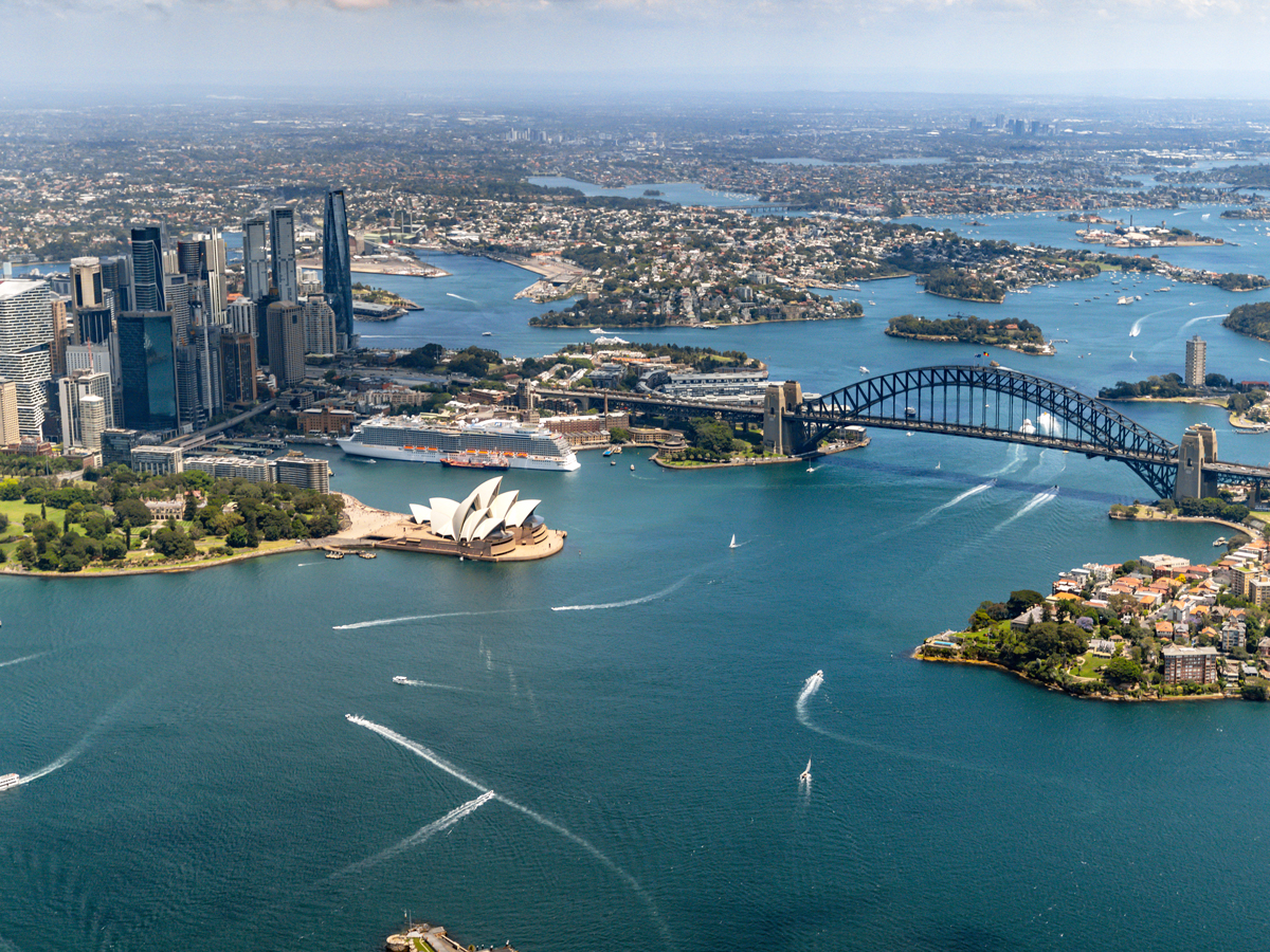 Aerial view of Sydney Harbour today, with bridge and opera house