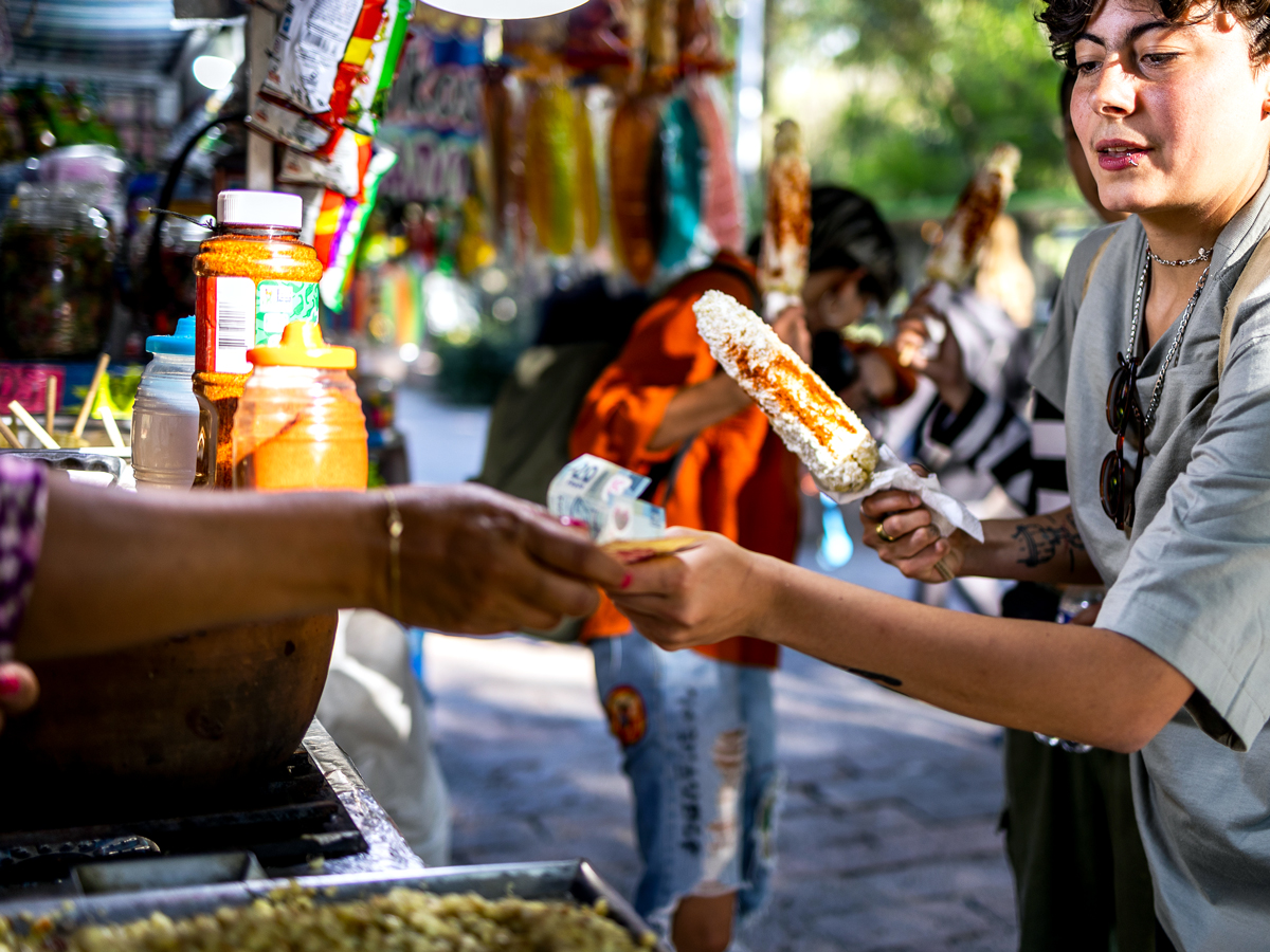 Patron paying for street food