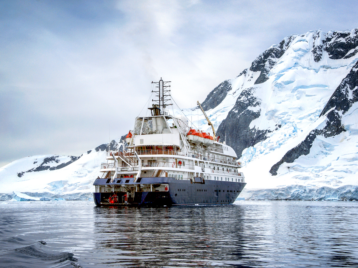 Cruise ship off the icy coast of Antarctica