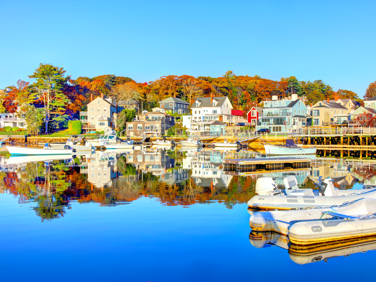 Buildings reflected in water in Manchester-by-the-Sea, Massachusetts