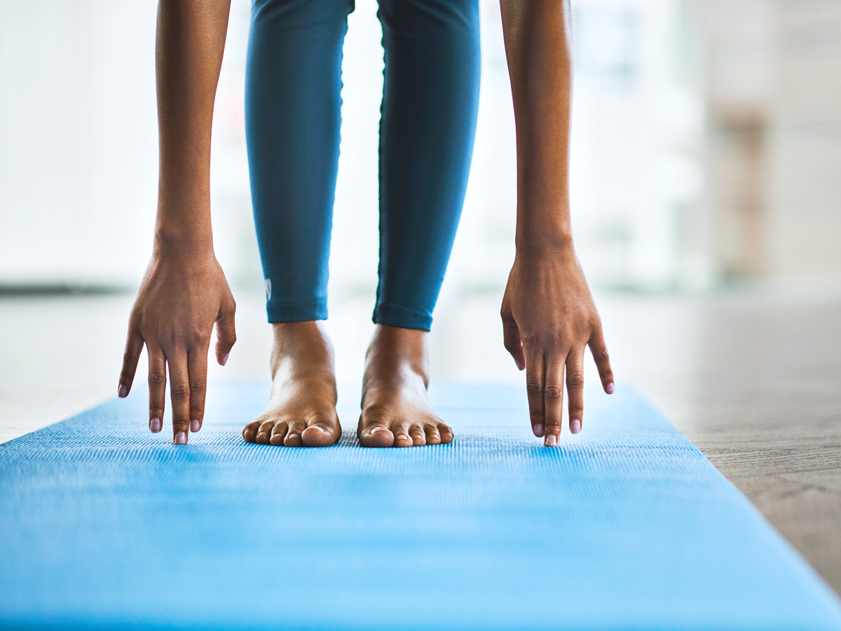 Person stretching on yoga mat
