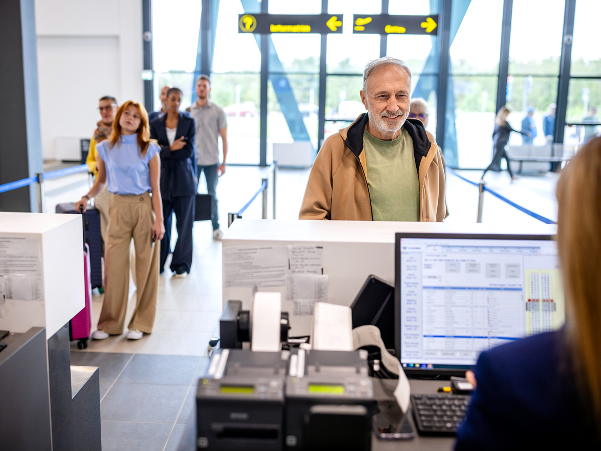 Passengers at airport check-in counter