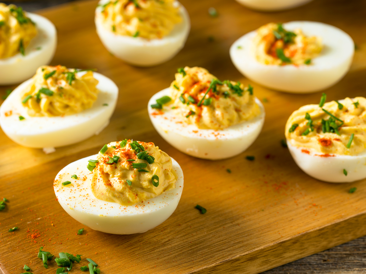 Deviled eggs on cutting board
