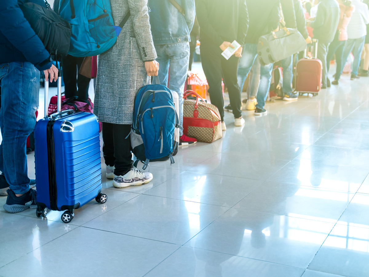 Passengers in queue at airport