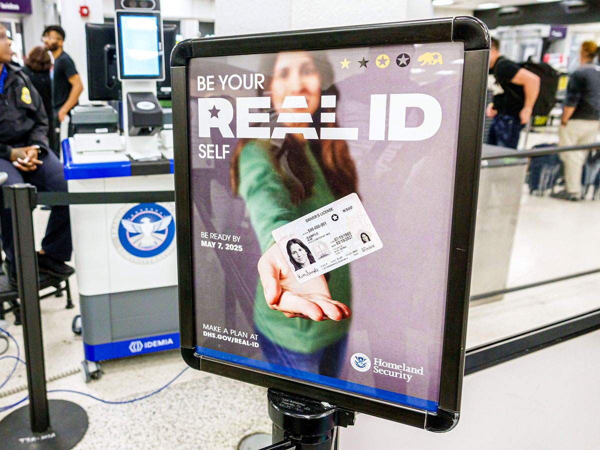 TSA sign detailing REAL ID requirements at airport security checkpoint