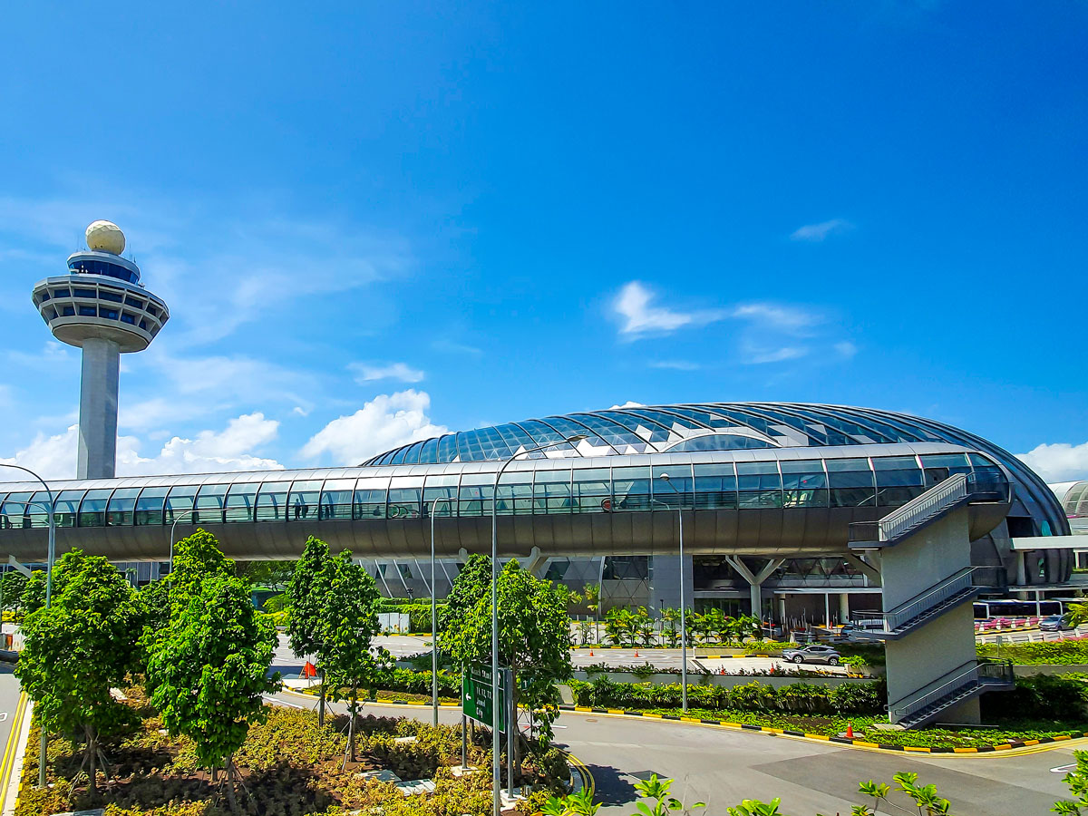 Control tower, airport terminal building, and roadway