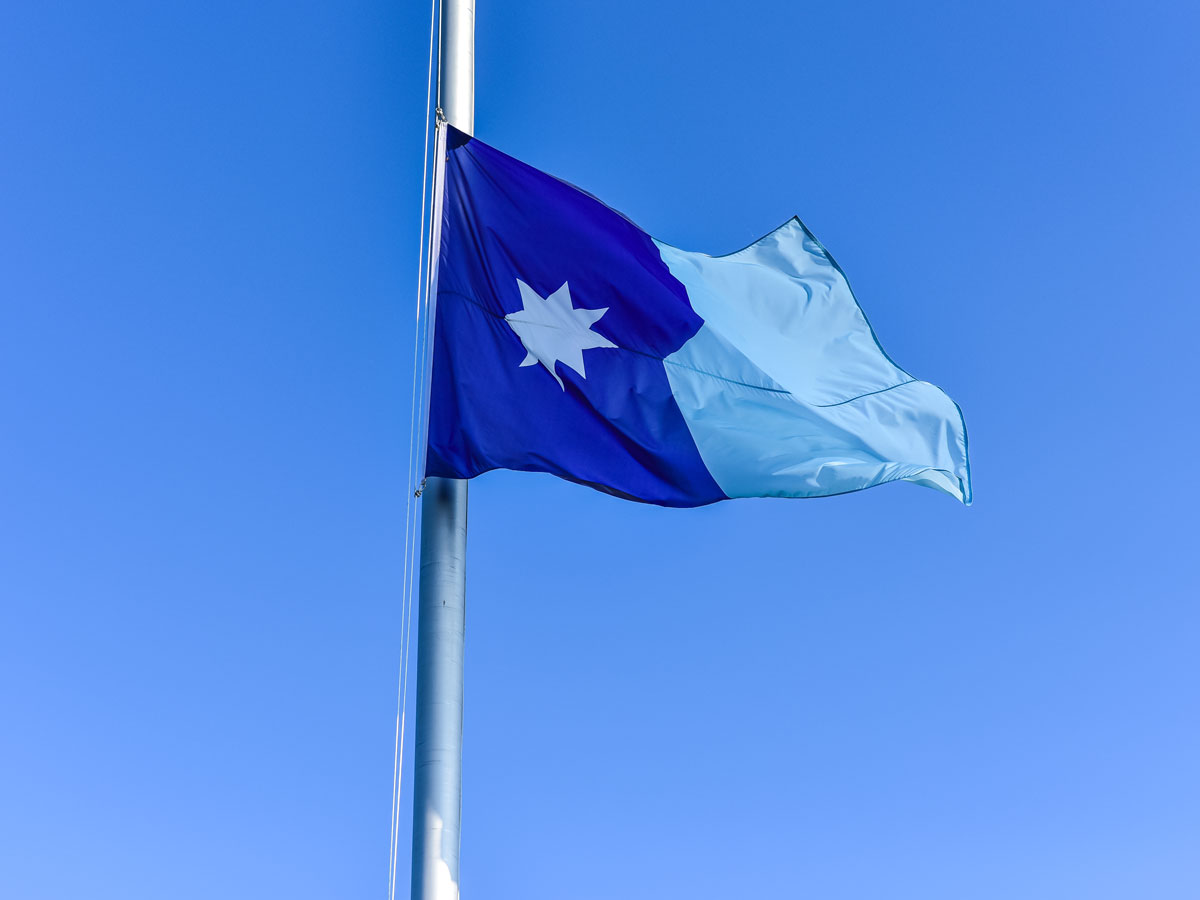 Minnesota flag at half mast