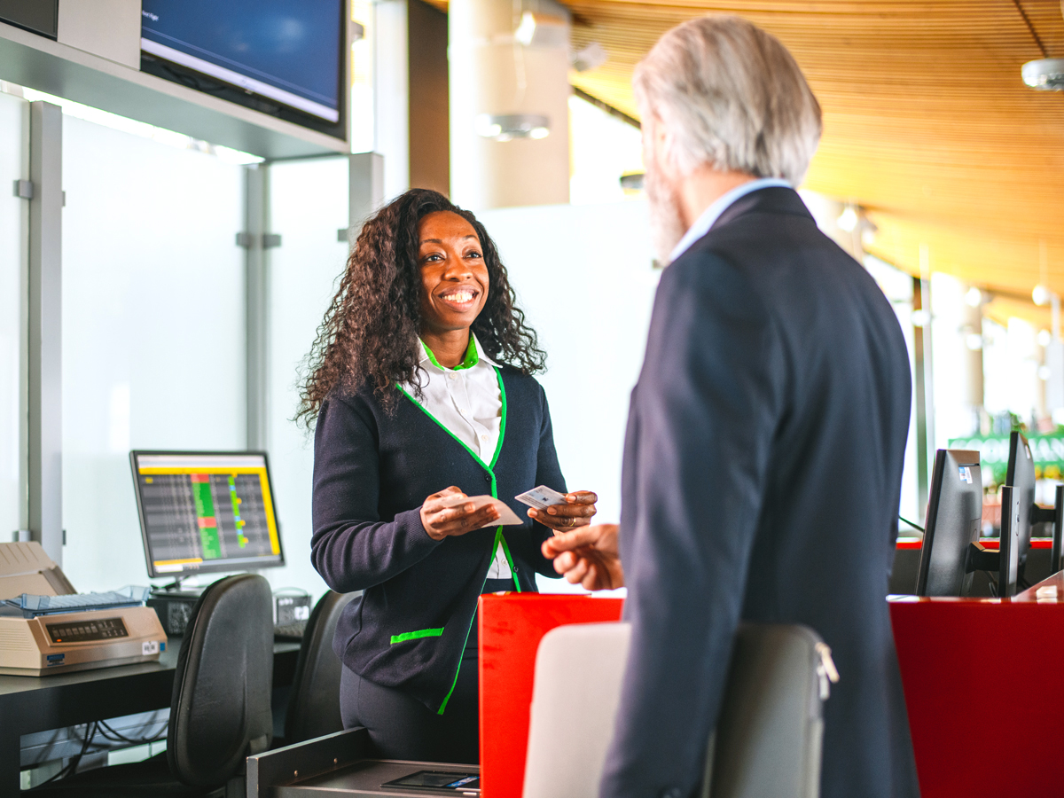 Passenger speaking to airline agent